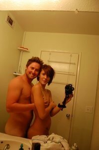 an amateur slut taking a selfie with her boyfriend