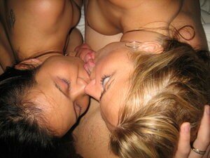 two girls licking a cock